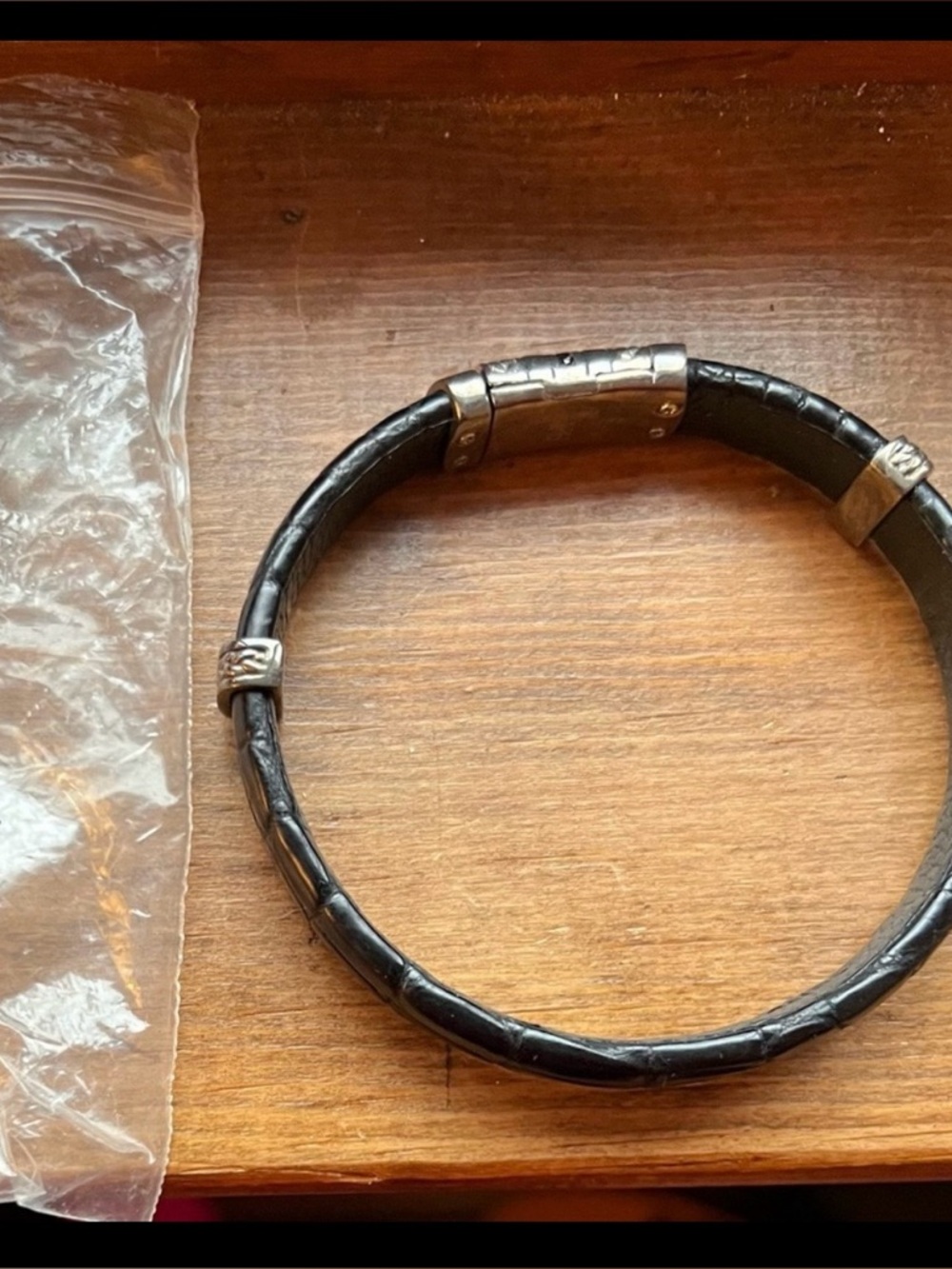 National Geographic black crocodile skin and silver bracelet.